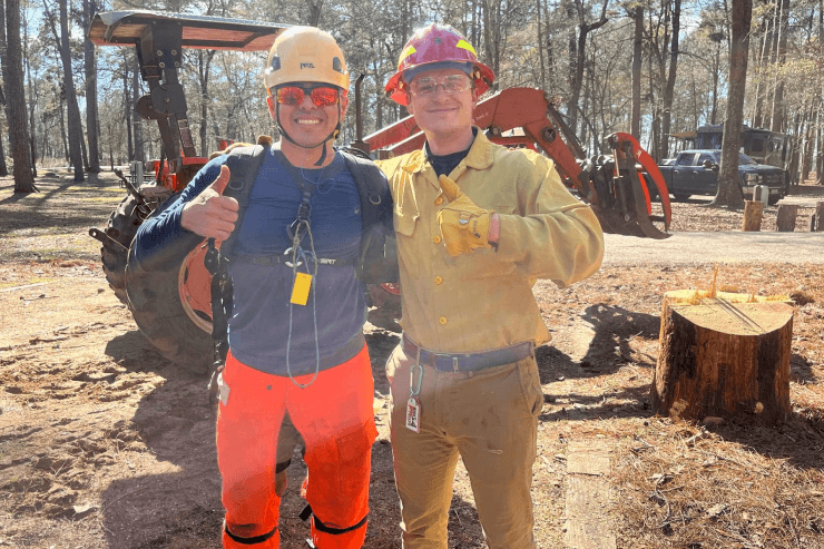 Amaya Tree Service crew members celebrating a completed job near Huntsville, TX